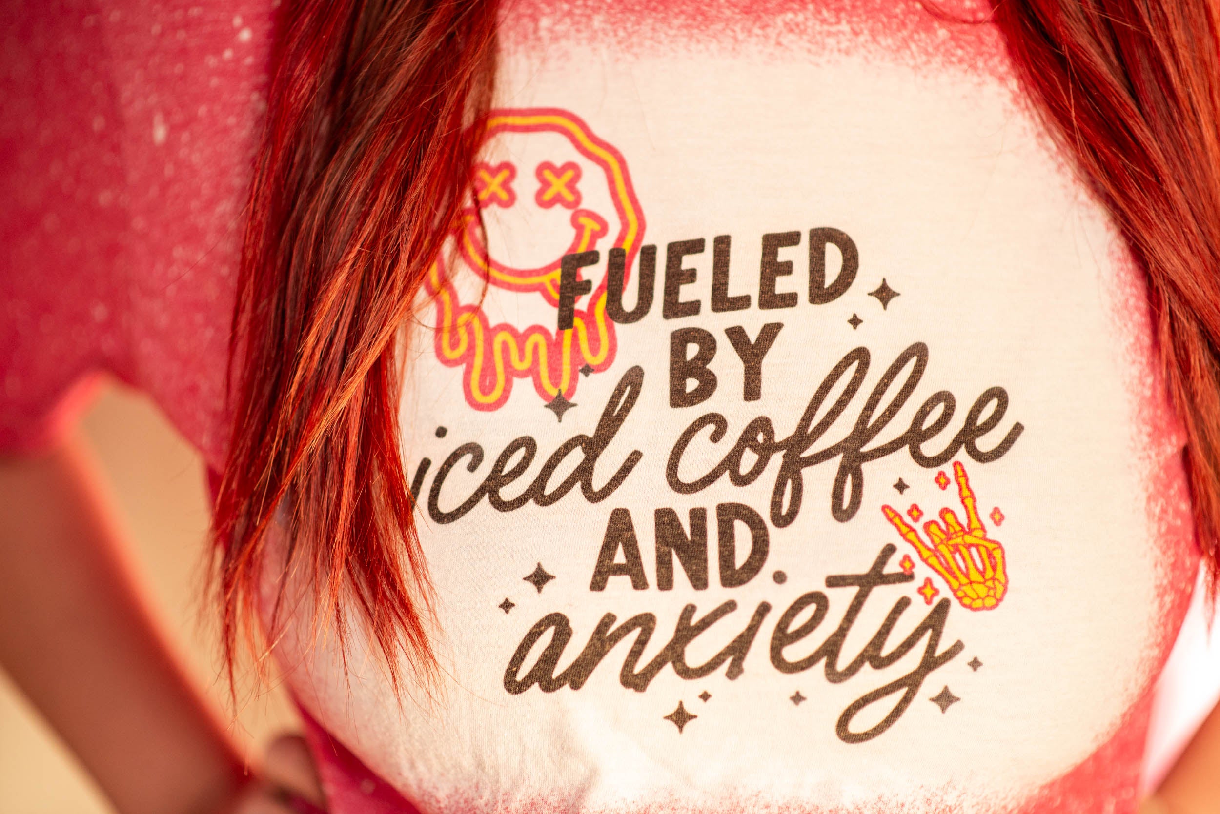 Fuel by iced coffee and anxiety. T-shirt in red tones, bleached. Adult size.