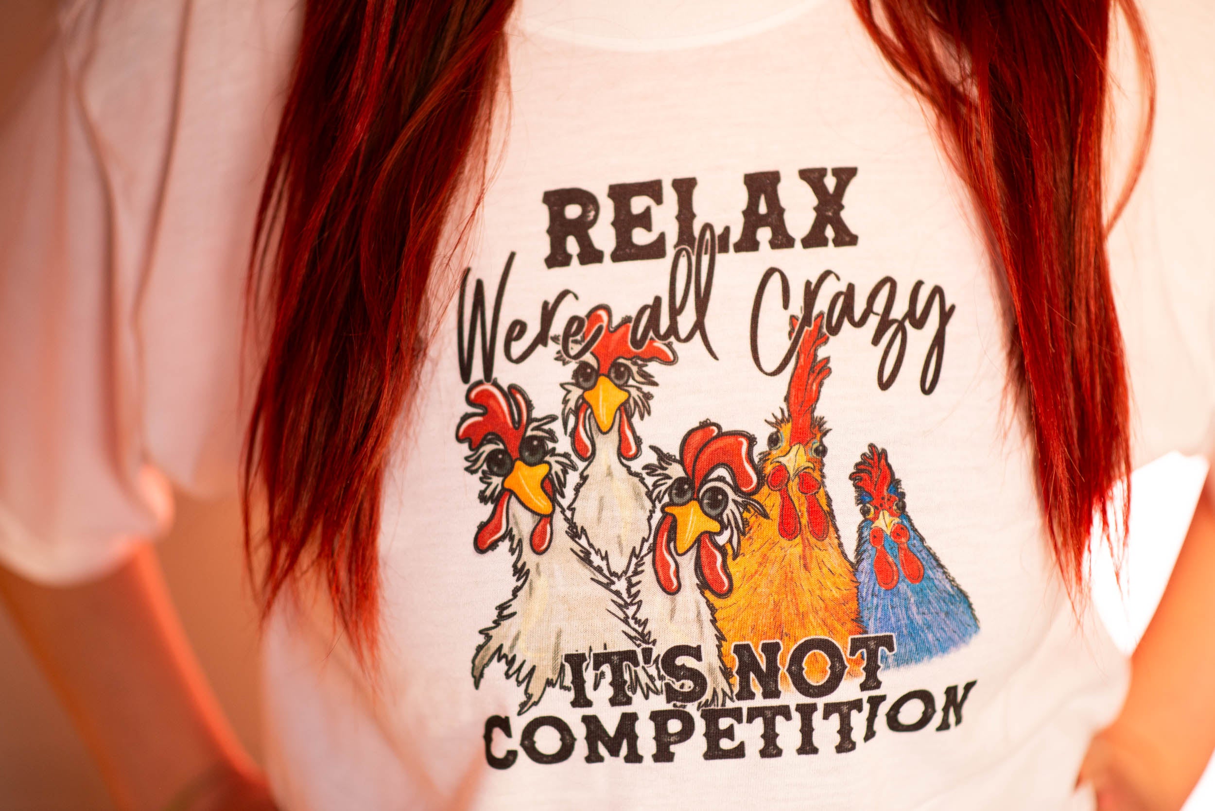 Relax, we're all crazy. Its not a competition. White t-shirt (Adult)
