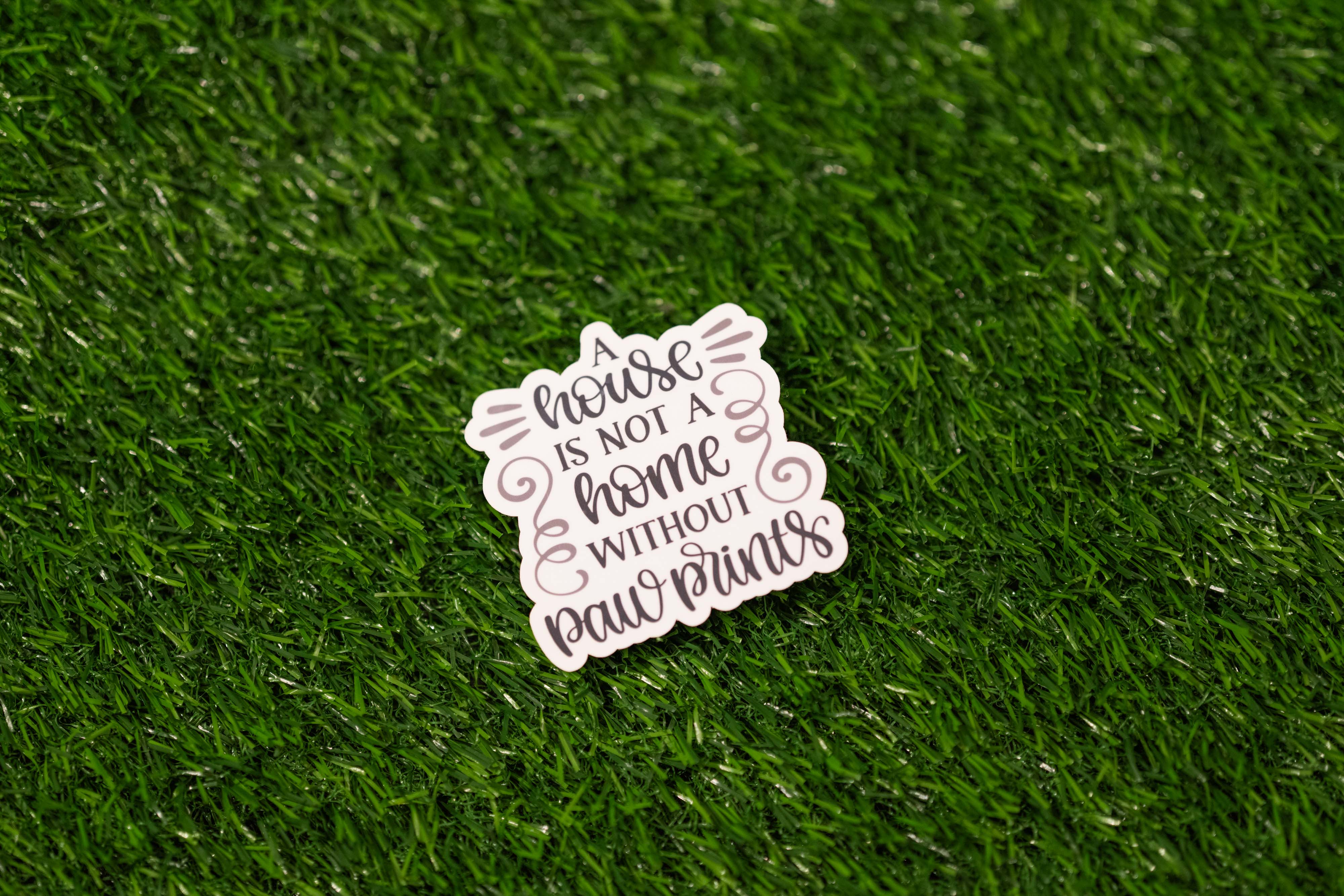 "A house is not a home without paw prints" Sticker (Single)